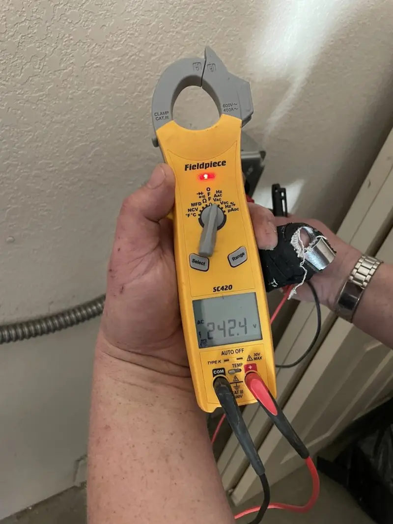 Voltage testing with clamp meter during Generator Installation in Denton